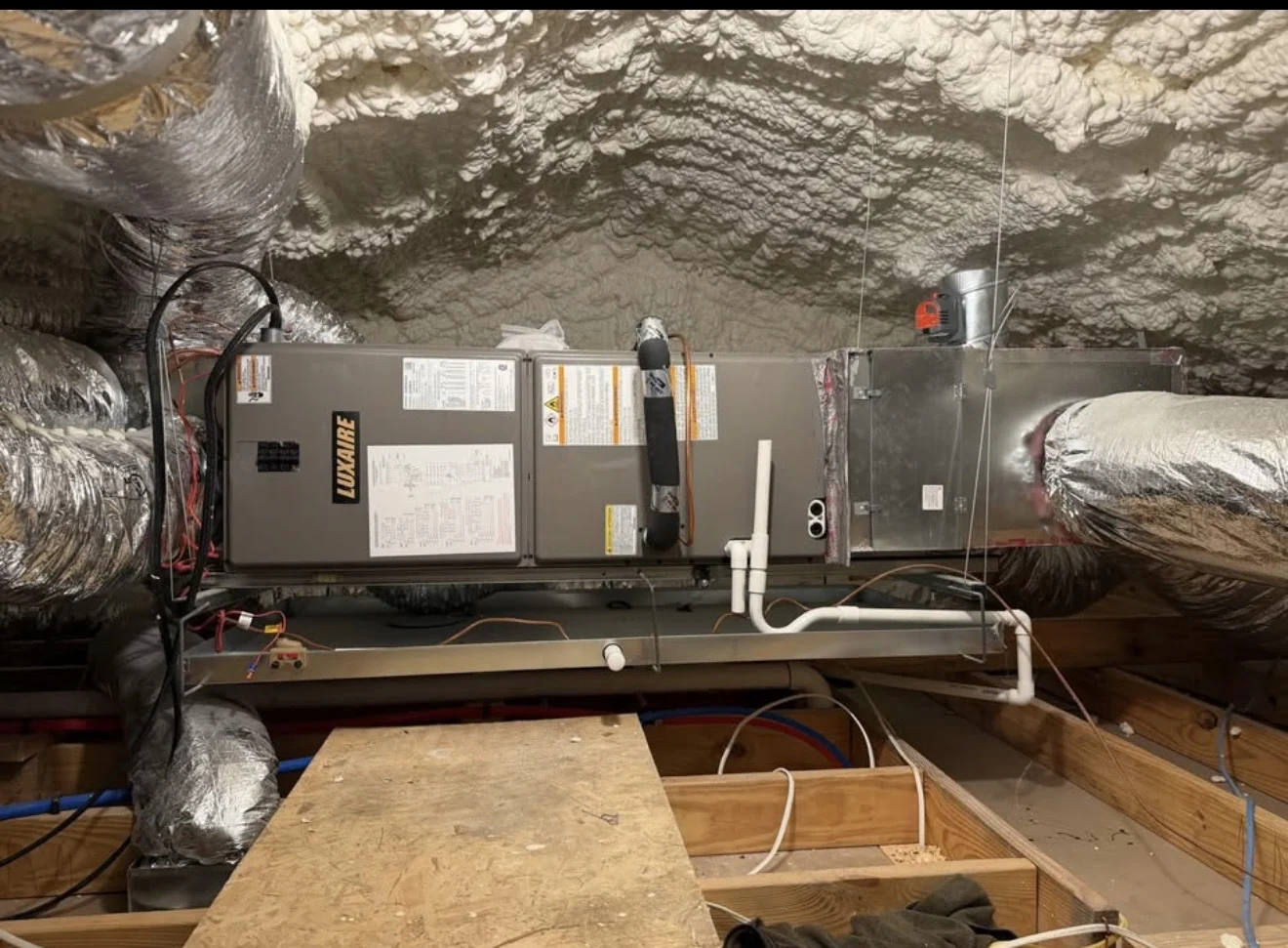Luxaire air handler installed in an insulated attic